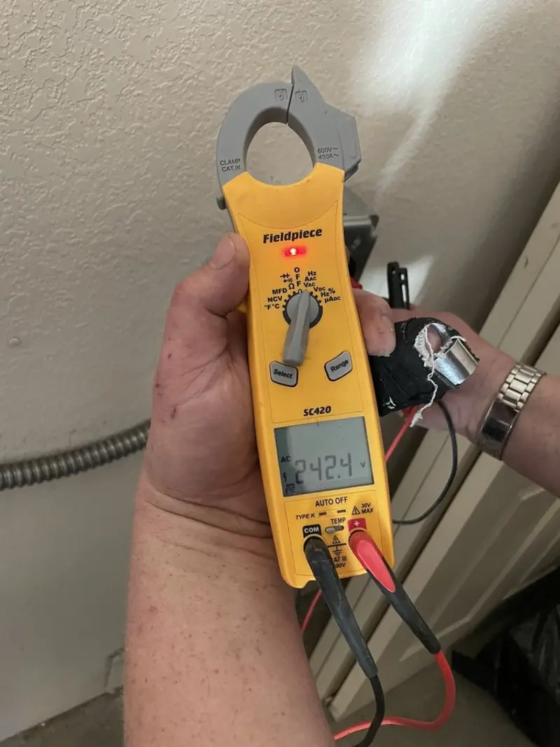 Voltage testing with clamp meter during Ceiling Fan Installation in Lexington